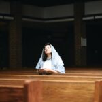 woman holding rosary